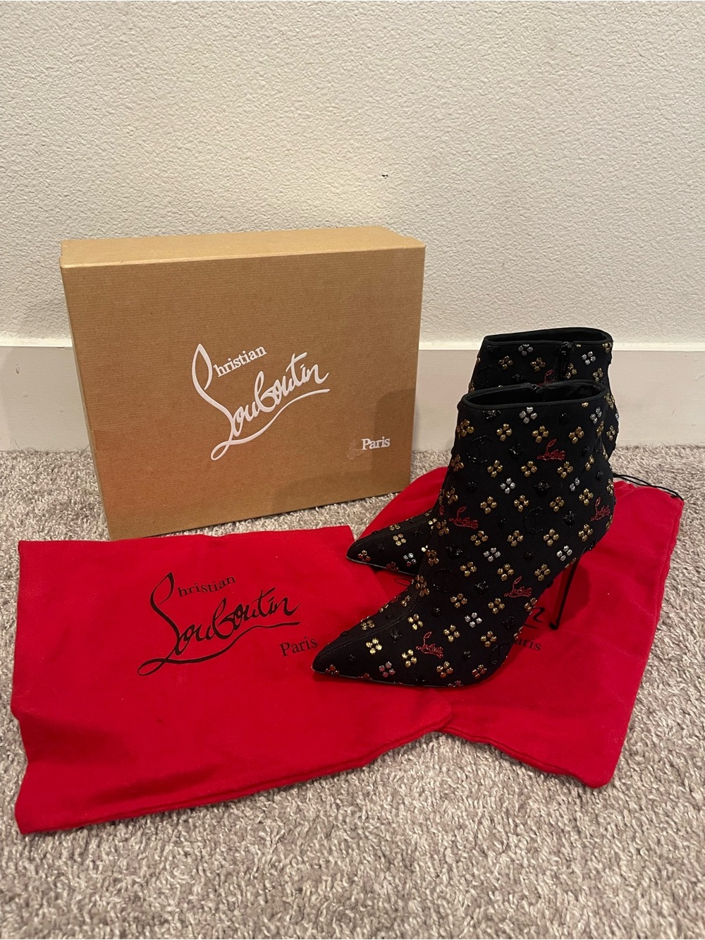 Christian Louboutin Black Embellished Pointed Toe Ankle Boots with Red Accents
